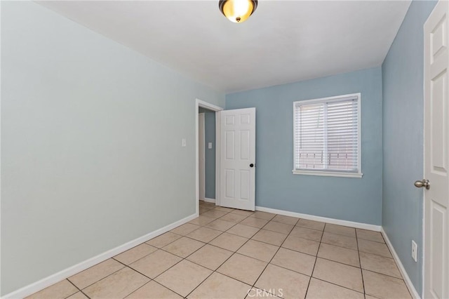 1048 S Record Ave, East Los Angeles, CA 90023 - spare room featuring light tile patterned flooring and baseboards