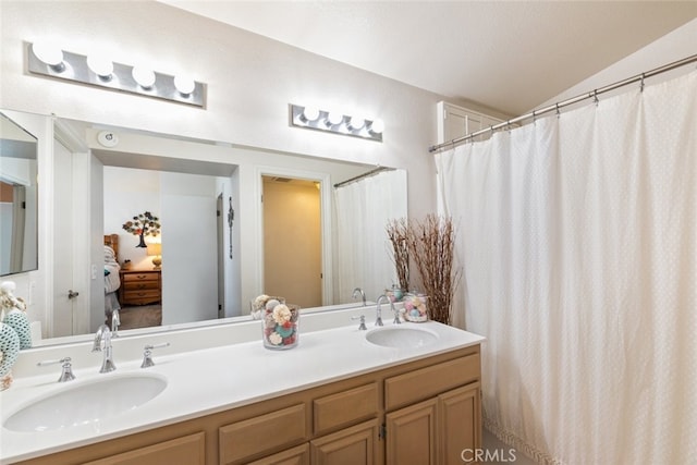16508 Nectarine Way, Lake Elsinore, CA 92530 - ensuite bathroom with double vanity and vaulted ceiling