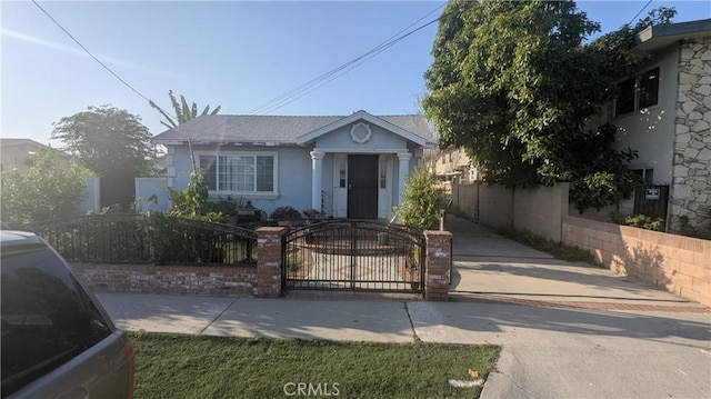 7261 9th St, Buena Park, CA 90621 - view of front facade featuring stucco siding and a gate