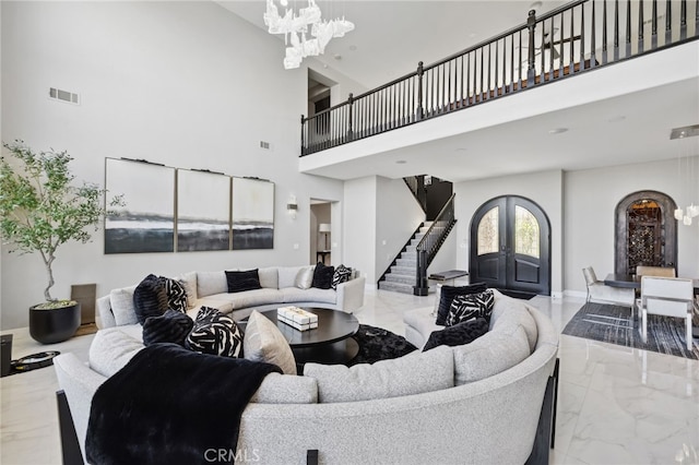 36472 County Line Rd, Yucaipa, CA 92399 - living area with marble tiled floors, a chandelier, stairs, and a high ceiling