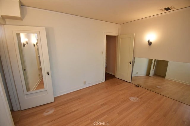 565 N Laurel Ave, Upland, CA 91786 - unfurnished bedroom with light wood-type flooring and baseboards
