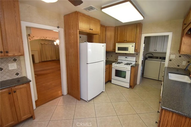 565 N Laurel Ave, Upland, CA 91786 - kitchen with white appliances, decorative backsplash, a ceiling fan, light tile patterned floors, and brown cabinets
