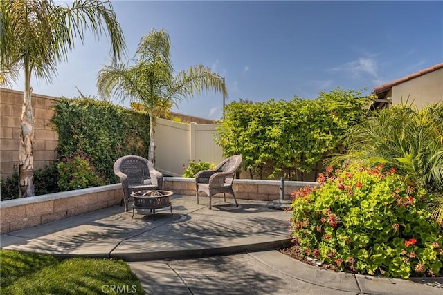 10963 Clementine Way, Loma Linda, CA 92354 - fenced backyard with an outdoor fire pit and a patio area
