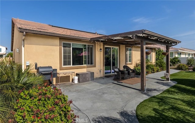 10963 Clementine Way, Loma Linda, CA 92354 - back of house with stucco siding, a patio area, a pergola, and a yard