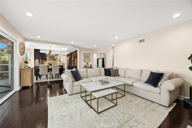 11900 Laughton Way, Porter Ranch, CA 91326 - living room featuring dark wood-type flooring, a chandelier, and recessed lighting