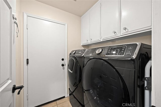 11900 Laughton Way, Porter Ranch, CA 91326 - laundry room featuring separate washer and dryer, cabinet space, and light tile patterned floors