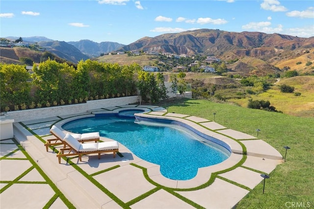 11900 Laughton Way, Porter Ranch, CA 91326 - view of swimming pool with a mountain view, a lawn, a pool with connected hot tub, and a patio area