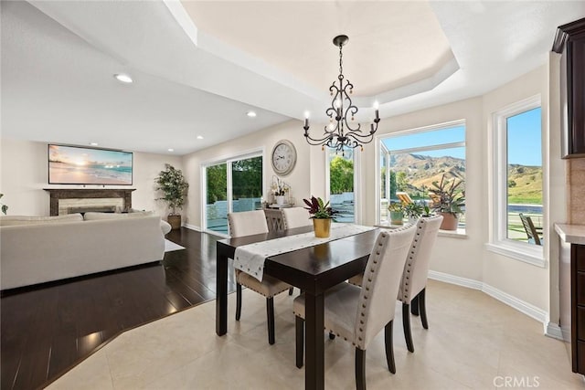 11900 Laughton Way, Porter Ranch, CA 91326 - dining area with a chandelier, a raised ceiling, and recessed lighting