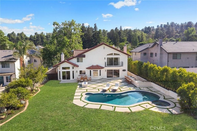 11900 Laughton Way, Porter Ranch, CA 91326 - rear view of property featuring a patio, stucco siding, a fenced backyard, and a pool with connected hot tub