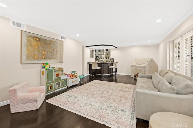 11900 Laughton Way, Porter Ranch, CA 91326 - living room featuring a dry bar, dark wood finished floors, ornamental molding, and recessed lighting
