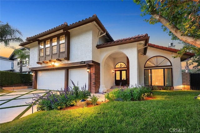 11900 Laughton Way, Porter Ranch, CA 91326 - mediterranean / spanish-style home featuring a garage, stucco siding, concrete driveway, a tiled roof, and french doors