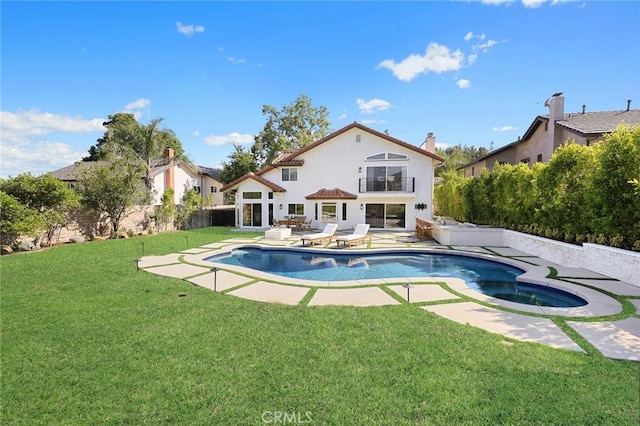 11900 Laughton Way, Porter Ranch, CA 91326 - back of property featuring a patio, an in-ground hot tub, stucco siding, a fenced backyard, and a chimney