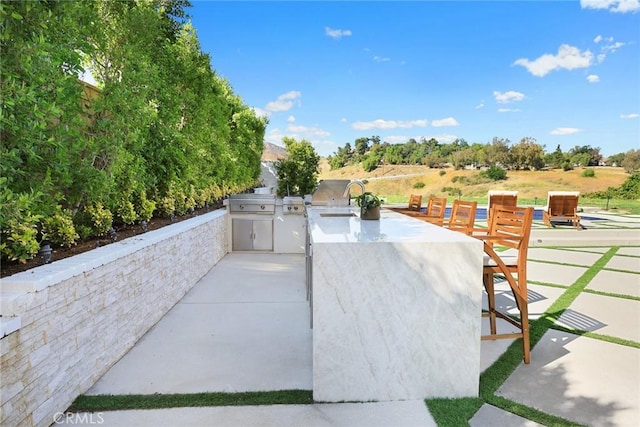 11900 Laughton Way, Porter Ranch, CA 91326 - view of patio with area for grilling and a sink