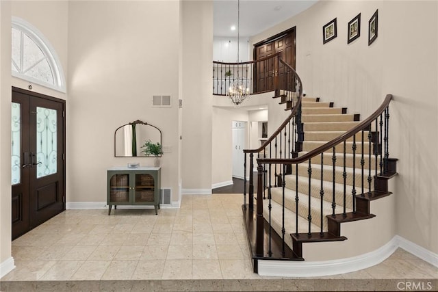 11900 Laughton Way, Porter Ranch, CA 91326 - foyer with a towering ceiling, stairway, a chandelier, and french doors