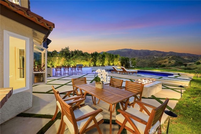 11900 Laughton Way, Porter Ranch, CA 91326 - view of patio with an outdoor pool, a mountain view, and outdoor dining space