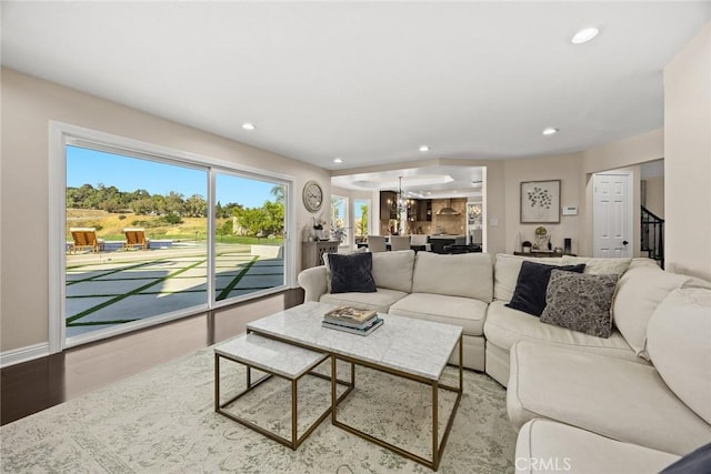 11900 Laughton Way, Porter Ranch, CA 91326 - living room with recessed lighting, wood finished floors, and a chandelier