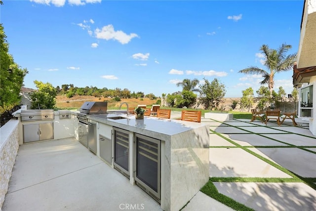 11900 Laughton Way, Porter Ranch, CA 91326 - view of patio with wine cooler and area for grilling
