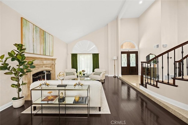 11900 Laughton Way, Porter Ranch, CA 91326 - living area featuring high vaulted ceiling, wood finished floors, stairs, a fireplace, and french doors