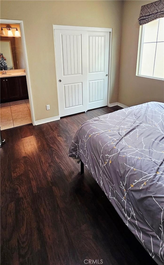 15048 Westin Ln, La Mirada, CA 90638 - bedroom featuring wood finished floors, a closet, and connected bathroom