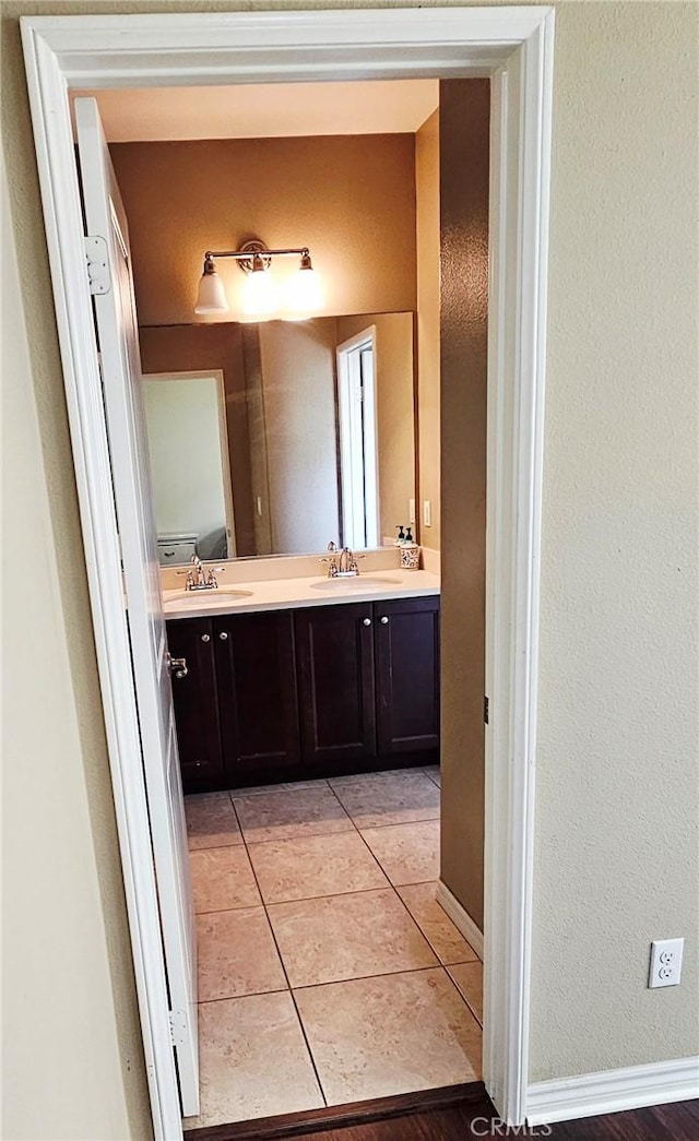 15048 Westin Ln, La Mirada, CA 90638 - full bathroom featuring double vanity, tile patterned flooring, and a textured wall