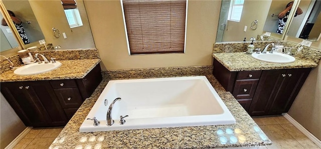 15048 Westin Ln, La Mirada, CA 90638 - bathroom with two vanities, a garden tub, and tile patterned flooring