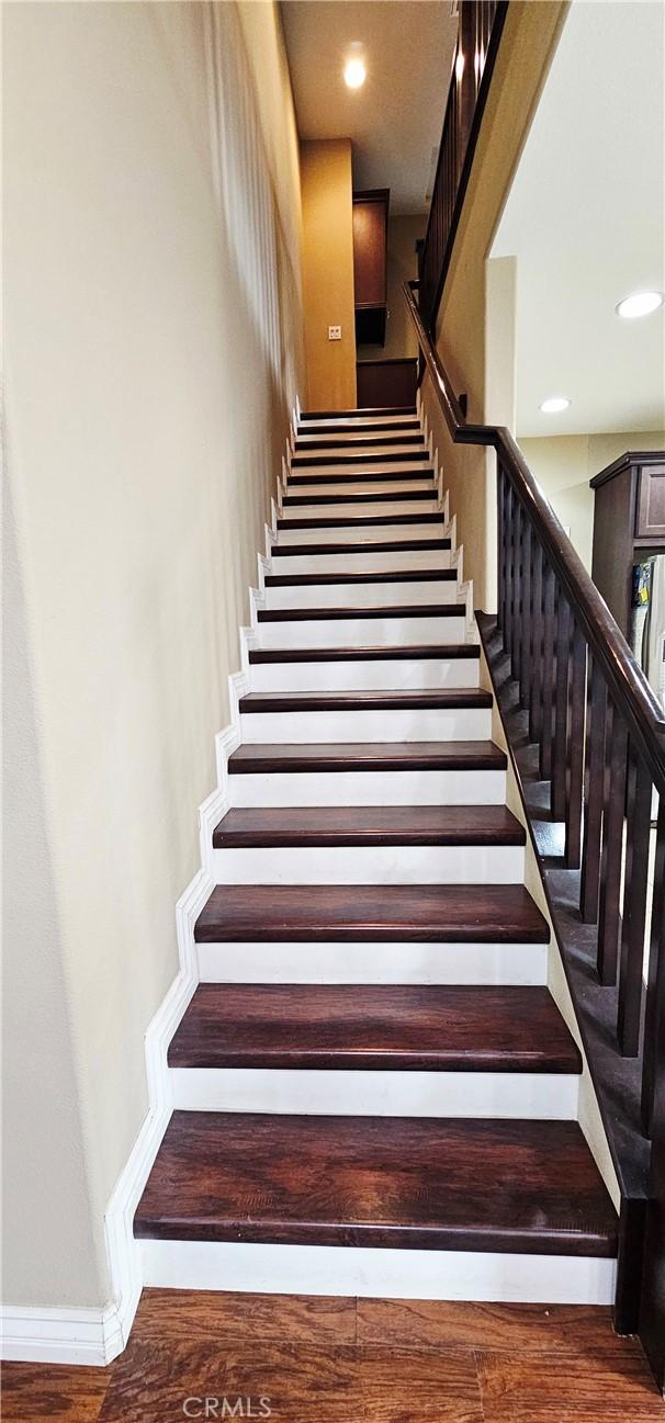 15048 Westin Ln, La Mirada, CA 90638 - stairway with recessed lighting and wood finished floors