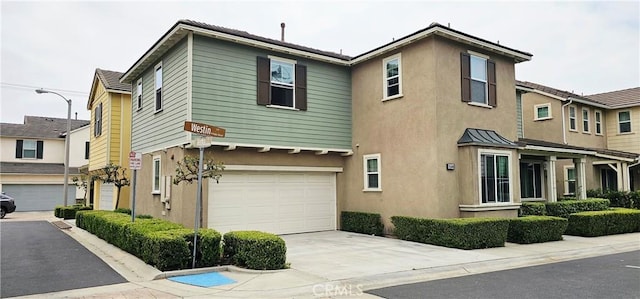 15048 Westin Ln, La Mirada, CA 90638 - view of front of house featuring driveway, stucco siding, and a garage