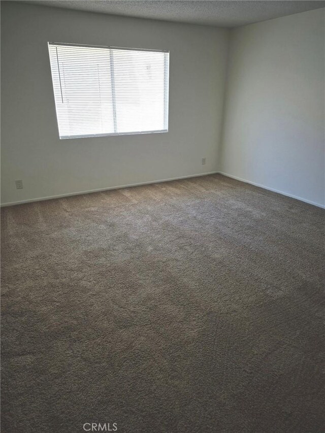 13325 Kornblum Ave, Hawthorne, CA 90250 - empty room with carpet and baseboards