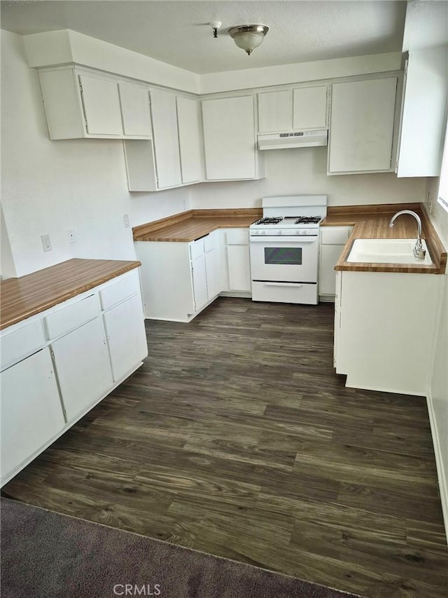 13325 Kornblum Ave, Hawthorne, CA 90250 - kitchen featuring white range with gas stovetop, under cabinet range hood, white cabinetry, dark wood finished floors, and wooden counters