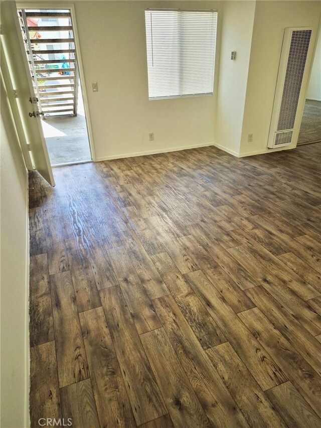13325 Kornblum Ave, Hawthorne, CA 90250 - unfurnished room with a heating unit and dark wood finished floors