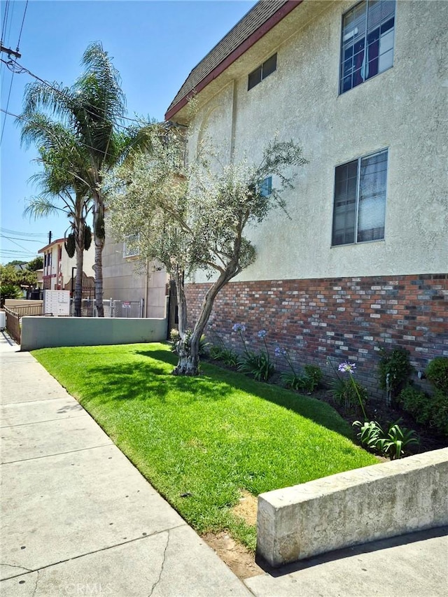 13325 Kornblum Ave, Hawthorne, CA 90250 - view of side of home featuring stucco siding