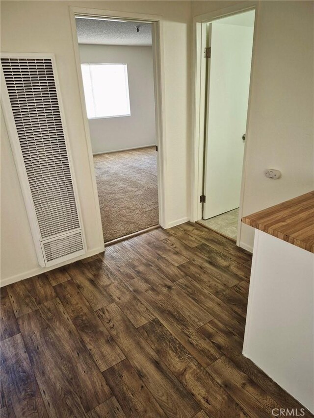 13325 Kornblum Ave, Hawthorne, CA 90250 - hallway with a heating unit and dark wood-style flooring
