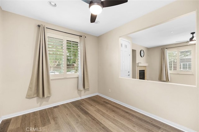 8015 Yeager St, Chino, CA 91708 - unfurnished room with ceiling fan, wood finished floors, healthy amount of natural light, a tile fireplace, and recessed lighting