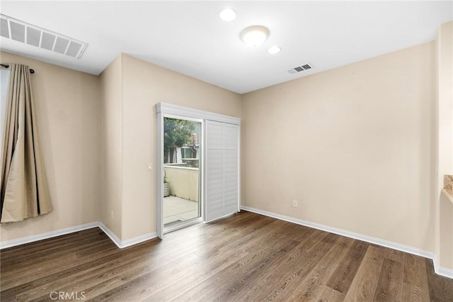 8015 Yeager St, Chino, CA 91708 - unfurnished bedroom with wood finished floors and access to outside