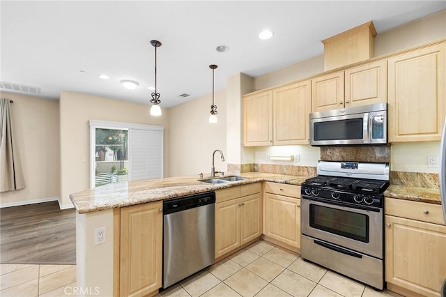 8015 Yeager St, Chino, CA 91708 - kitchen with light brown cabinets, stainless steel appliances, a peninsula, light tile patterned floors, and recessed lighting