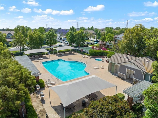 8015 Yeager St, Chino, CA 91708 - community pool featuring a patio area, a residential view, and view of scattered trees