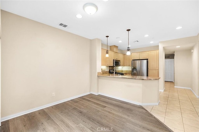 8015 Yeager St, Chino, CA 91708 - kitchen with appliances with stainless steel finishes, light brown cabinets, a peninsula, recessed lighting, and light wood finished floors
