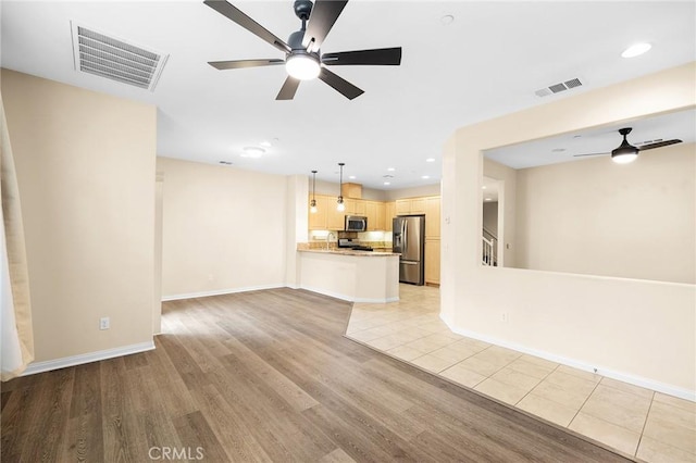 8015 Yeager St, Chino, CA 91708 - unfurnished living room featuring a ceiling fan, light wood-style flooring, and recessed lighting