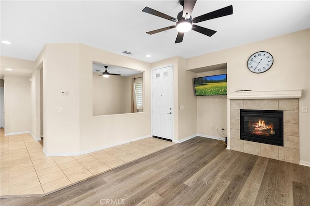 8015 Yeager St, Chino, CA 91708 - unfurnished living room featuring a ceiling fan, wood finished floors, a fireplace, and recessed lighting