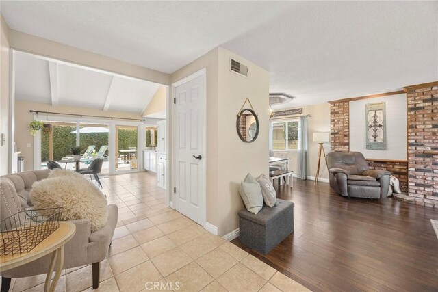 3112 N Hearthside St, Orange, CA 92865 - living room featuring plenty of natural light, wood finished floors, and a textured ceiling