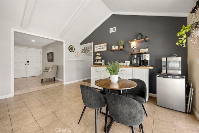 3112 N Hearthside St, Orange, CA 92865 - dining space featuring light tile patterned flooring and vaulted ceiling