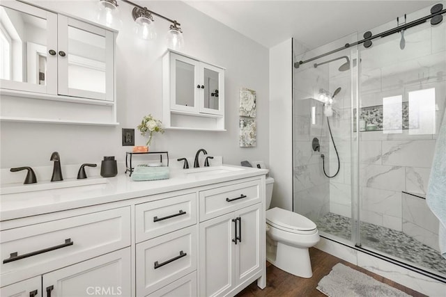 3112 N Hearthside St, Orange, CA 92865 - bathroom featuring a shower stall, double vanity, and wood finished floors
