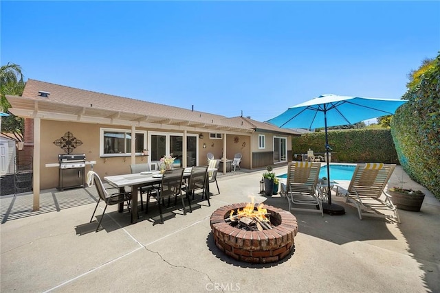 3112 N Hearthside St, Orange, CA 92865 - view of patio / terrace featuring a fire pit, a grill, and outdoor dining area