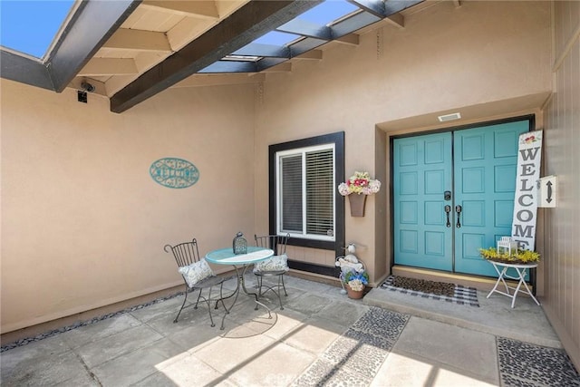 3112 N Hearthside St, Orange, CA 92865 - property entrance with stucco siding, a patio, and outdoor dining area