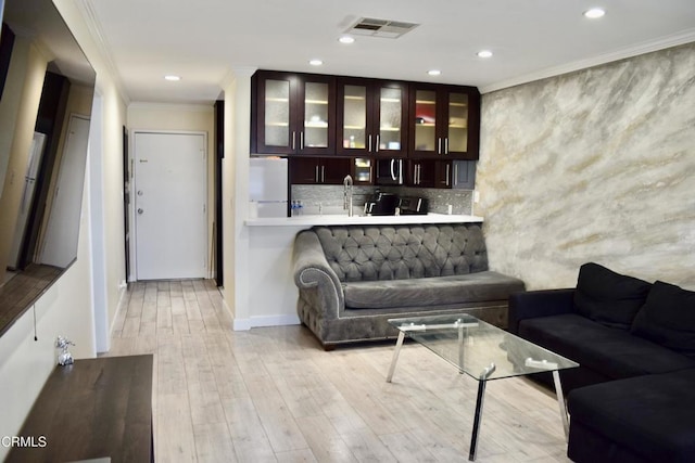 10149 Commerce Ave Unit 2, Tujunga, CA 91042 - living room featuring crown molding, light wood-style floors, and recessed lighting
