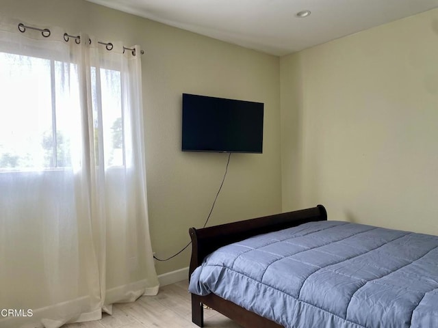 10149 Commerce Ave Unit 2, Tujunga, CA 91042 - bedroom featuring multiple windows and light wood-style floors