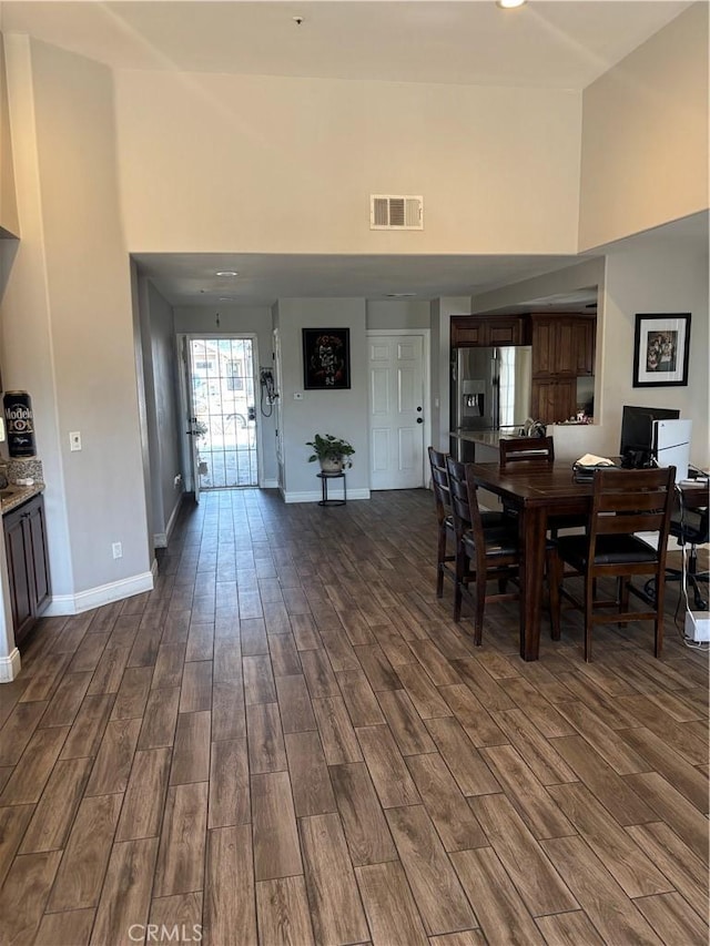 13841 Cobblestone Ct, Fontana, CA 92335 - dining room featuring high vaulted ceiling and dark wood-style flooring