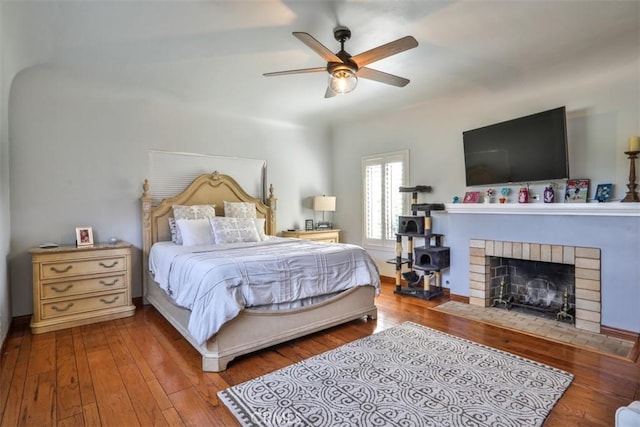 1853 E Renshaw St, Covina, CA 91724 - bedroom featuring wood-type flooring, a fireplace, and ceiling fan