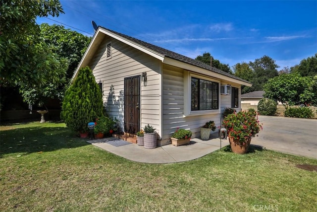 1853 E Renshaw St, Covina, CA 91724 - view of home's exterior with a lawn and an outdoor structure