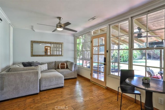 1853 E Renshaw St, Covina, CA 91724 - living room featuring ceiling fan, crown molding, and wood finished floors